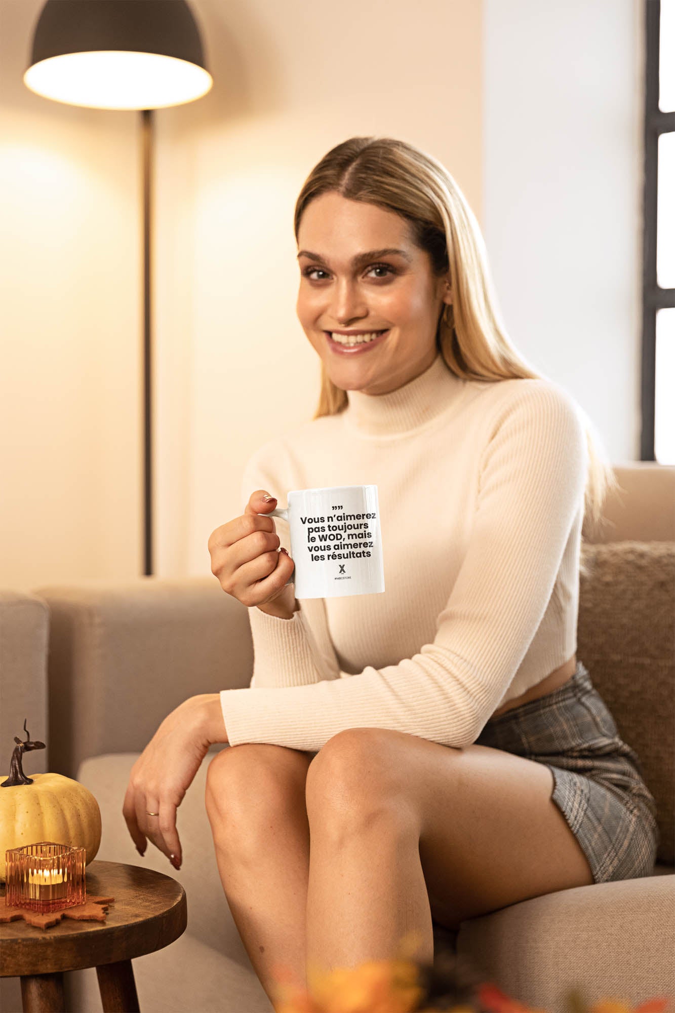 thanksgiving-themed-coffee-mug-mockup-of-a-woman-sitting-in-her-living-room-m35688.jpg